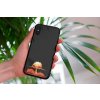 mockup of a woman holding a clear phone case in front of a houseplant 4636 el1 2023 03 30T105906.498