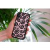 mockup of a woman holding a clear phone case in front of a houseplant 4636 el1 (73)