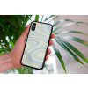 mockup of a woman holding a clear phone case in front of a houseplant 4636 el1 2022 04 19T145029.758