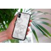 mockup of a woman holding a clear phone case in front of a houseplant 4636 el1 2022 04 27T131915.110