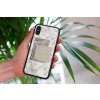 mockup of a woman holding a clear phone case in front of a houseplant 4636 el1 2022 05 04T104722.749