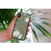 mockup of a woman holding a clear phone case in front of a houseplant 4636 el1 2022 05 04T112018.811