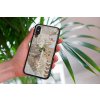 mockup of a woman holding a clear phone case in front of a houseplant 4636 el1 2022 05 18T145806.591