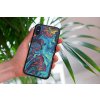 mockup of a woman holding a clear phone case in front of a houseplant 4636 el1 2022 04 26T123713.963
