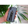 mockup of a woman holding a clear phone case in front of a houseplant 4636 el1 (5)