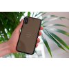 mockup of a woman holding a clear phone case in front of a houseplant 4636 el1 (46)