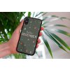 mockup of a woman holding a clear phone case in front of a houseplant 4636 el1 (4)