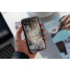 mockup of a man holding a clear phone case 4638 el1 (4)