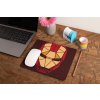 mockup of a mousepad lying on a rustic table next to a flower vase 27554 (33)