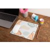 mockup of a mousepad lying on a rustic table next to a flower vase 27554 (49)