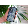 mockup of a woman holding a clear phone case in front of a houseplant 4636 el1 2023 06 20T155415.297