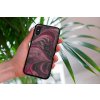 mockup of a woman holding a clear phone case in front of a houseplant 4636 el1 2023 06 20T142418.110