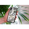 mockup of a woman holding a clear phone case in front of a houseplant 4636 el1 2023 06 20T151631.346