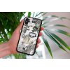 mockup of a woman holding a clear phone case in front of a houseplant 4636 el1 2023 06 20T151631.346