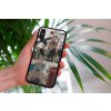 mockup of a woman holding a clear phone case in front of a houseplant 4636 el1 2023 06 20T141728.606