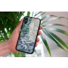 mockup of a woman holding a clear phone case in front of a houseplant 4636 el1 2023 06 20T140526.877
