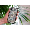 mockup of a woman holding a clear phone case in front of a houseplant 4636 el1 2023 06 20T145608.269