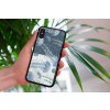mockup of a woman holding a clear phone case in front of a houseplant 4636 el1 2023 06 20T133601.831