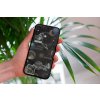 mockup of a woman holding a clear phone case in front of a houseplant 4636 el1 2023 06 20T122000.163