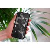 mockup of a woman holding a clear phone case in front of a houseplant 4636 el1 2023 06 20T113830.186