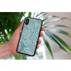 mockup of a woman holding a clear phone case in front of a houseplant 4636 el1 2023 06 20T150304.495