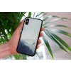 mockup of a woman holding a clear phone case in front of a houseplant 4636 el1 2023 06 20T120012.412