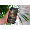 mockup of a woman holding a clear phone case in front of a houseplant 4636 el1 2023 06 20T122728.039