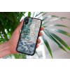 mockup of a woman holding a clear phone case in front of a houseplant 4636 el1 2023 06 20T140526.877