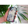 mockup of a woman holding a clear phone case in front of a houseplant 4636 el1 2023 06 20T145405.475