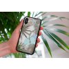 mockup of a woman holding a clear phone case in front of a houseplant 4636 el1 2023 06 20T133735.853