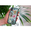 mockup of a woman holding a clear phone case in front of a houseplant 4636 el1 2023 06 20T113150.782