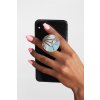 mockup of a hand holding a phone with a phone grip on a plain background 28169