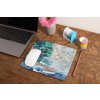 mockup of a mousepad lying on a rustic table next to a flower vase 27554 (45)