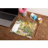 mockup of a mousepad lying on a rustic table next to a flower vase 27554