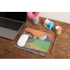 mockup of a mousepad lying on a rustic table next to a flower vase 27554 (85)