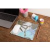 mockup of a mousepad lying on a rustic table next to a flower vase 27554 (50)