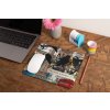 mockup of a mousepad lying on a rustic table next to a flower vase 27554 (40)