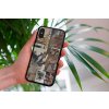 mockup of a woman holding a clear phone case in front of a houseplant 4636 el1 2023 09 08T093419.106