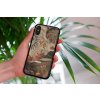mockup of a woman holding a clear phone case in front of a houseplant 4636 el1 2023 09 08T122353.668