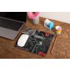 mockup of a mousepad lying on a rustic table next to a flower vase 27554