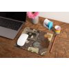 mockup of a mousepad lying on a rustic table next to a flower vase 27554