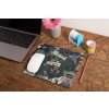 mockup of a mousepad lying on a rustic table next to a flower vase 27554
