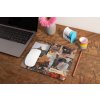 mockup of a mousepad lying on a rustic table next to a flower vase 27554