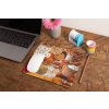 mockup of a mousepad lying on a rustic table next to a flower vase 27554