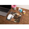 mockup of a mousepad lying on a rustic table next to a flower vase 27554