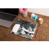 mockup of a mousepad lying on a rustic table next to a flower vase 27554 (1)