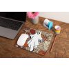 mockup of a mousepad lying on a rustic table next to a flower vase 27554