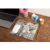 mockup of a mousepad lying on a rustic table next to a flower vase 27554