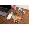 mockup of a mousepad lying on a rustic table next to a flower vase 27554 (1)