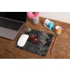 mockup of a mousepad lying on a rustic table next to a flower vase 27554